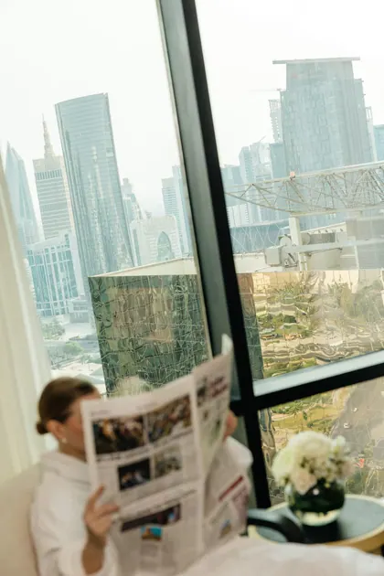 Hospitality — the morning paper by the window